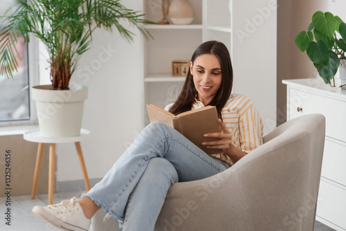 Beautiful woman reading boo...