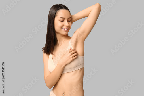 Young woman with smooth arm...