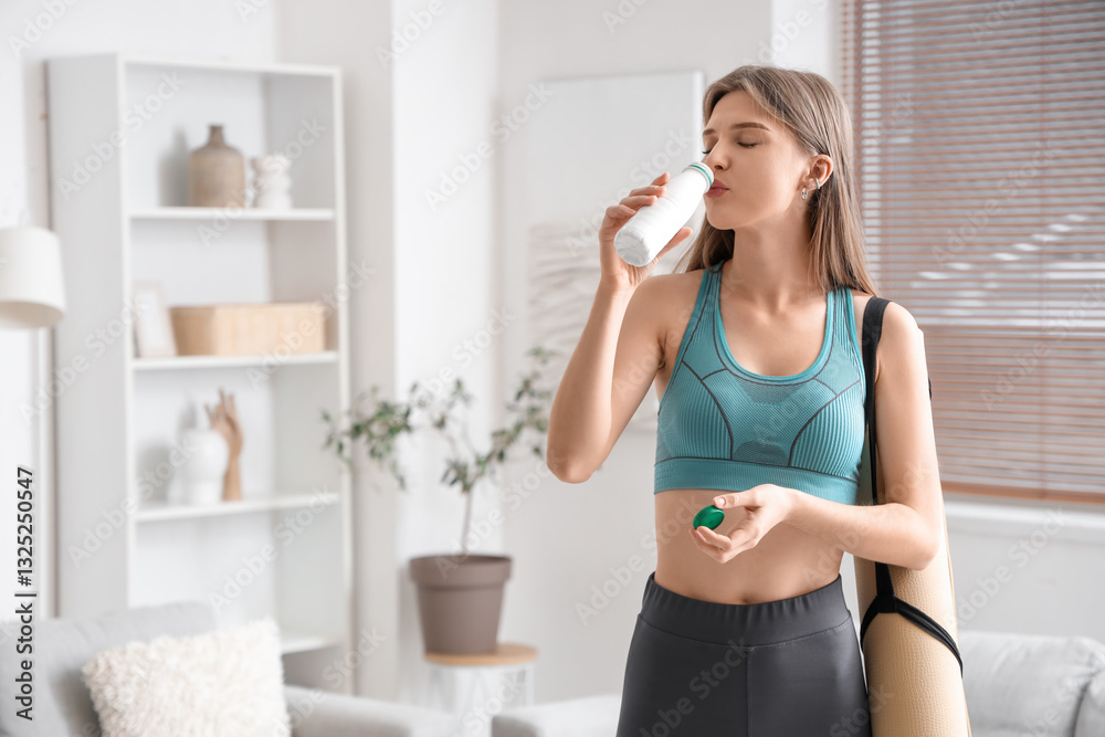 Sporty young woman drinking tasty yogurt at home Sporty young woman drinking tasty yogurt at home