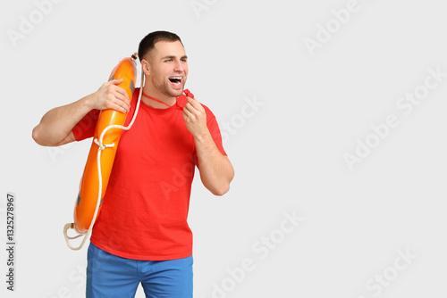 Happy young lifeguard with ...