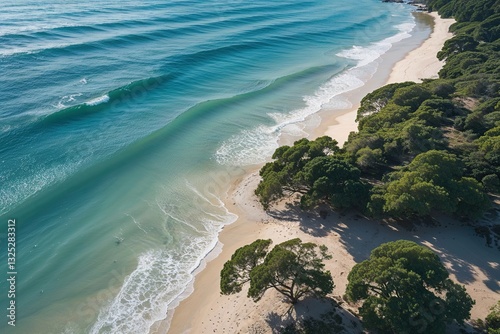 Stunning Aerial View of Tranquil Beach with Crystal Clear Waters and Gentle Waves Ideal for Summer Getaway