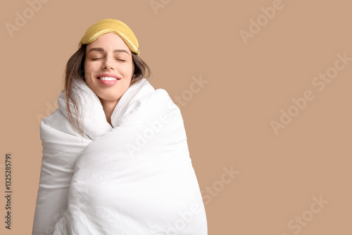 Young woman in blanket and ...