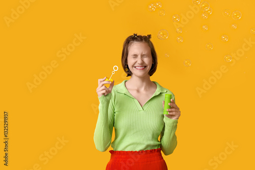 Happy teenage girl blowing ...
