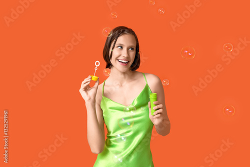 Teenage girl with soap bubb...