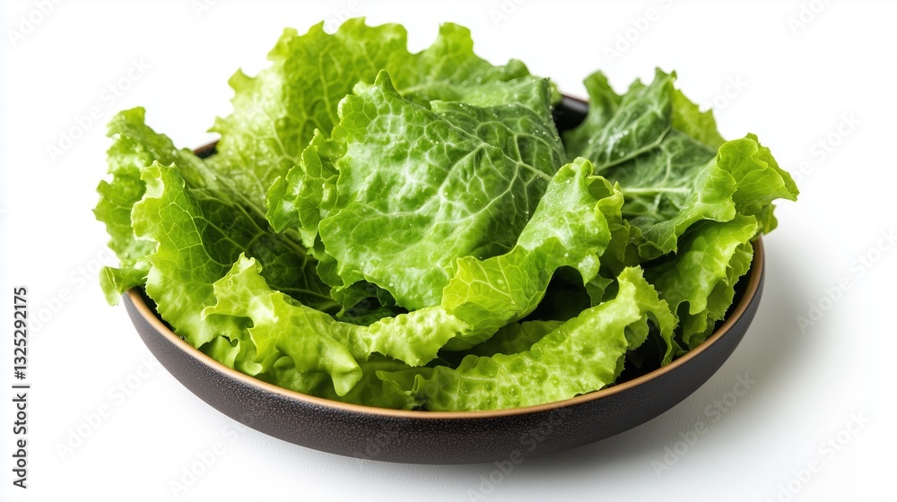 Fresh lettuce leaves in a plate, top view on a white background, isolate Fresh lettuce leaves in a plate, top view on a white background, isolate