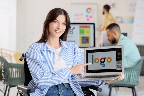 Female designer in wheelcha...