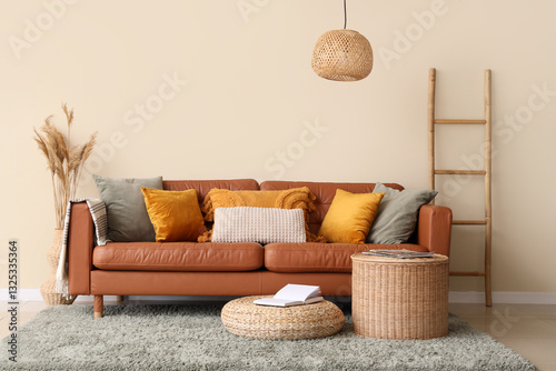 Comfortable sofa, coffee table and pouf in interior of living room