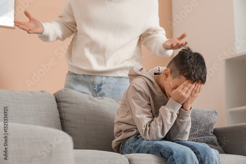 Crying boy with his father ...