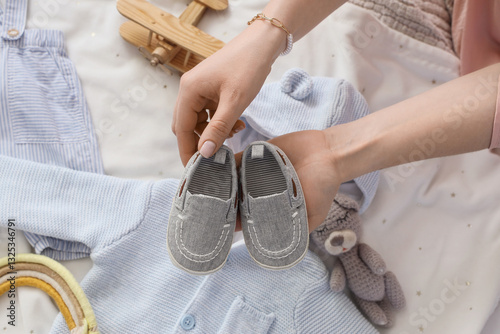 Woman with baby booties and...