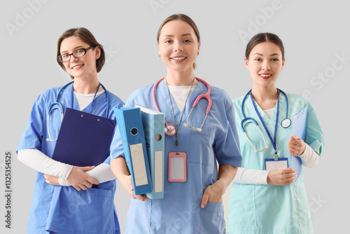 Female doctors with clipboa...