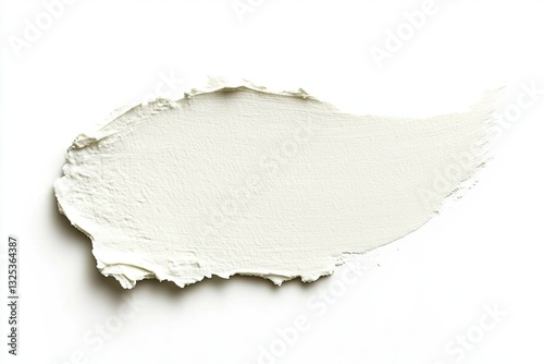 Creamy, light-toned cosmetic smudge on white background