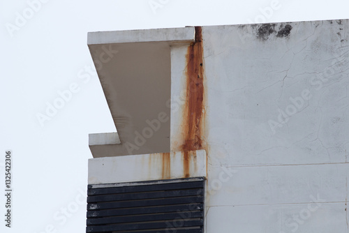The old building has rust stains from long rains in Thailand.