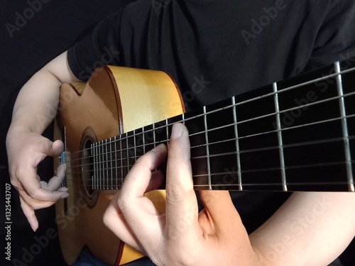 A man play flamenco guitar
