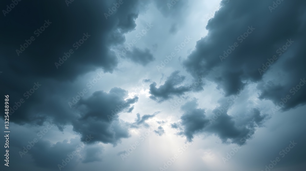 Fototapeta premium Dramatic Sky with Storm Clouds and Sunlight Breaking Through the Darkness