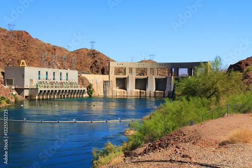 Hydroelectric Power Parker Dam beside transmission towers on the Colorado River and Lake Havasu, in Parker Dam, California, USA with blue sky copy space.
