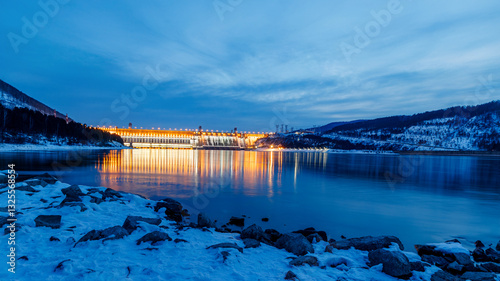 View of a hydroelectric dam on a river, long exposure photography at dusk