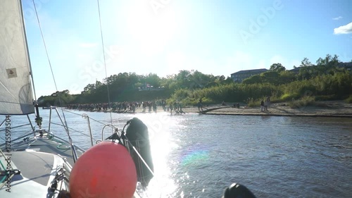 People meets Yacht And Sailboats Floating In The Amur River, Russia