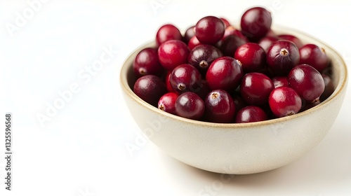 Bowl of ripe cranberries on white background