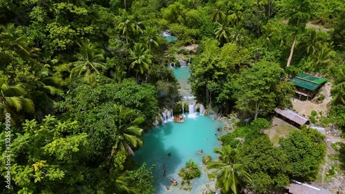 Tropical Waterfall with Turquoise Pools in Lush Jungle photo