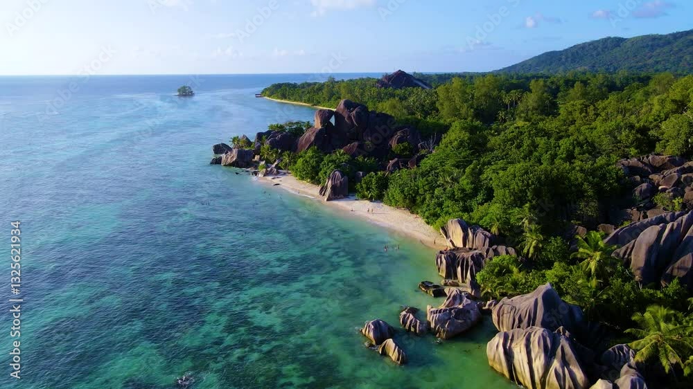 Anse Source D'Argent La Digue Seychelles coastline, featuring lush greenery, magnificent rock formations, and tranquil azure waters. Dive into the natural beauty and serene environment 