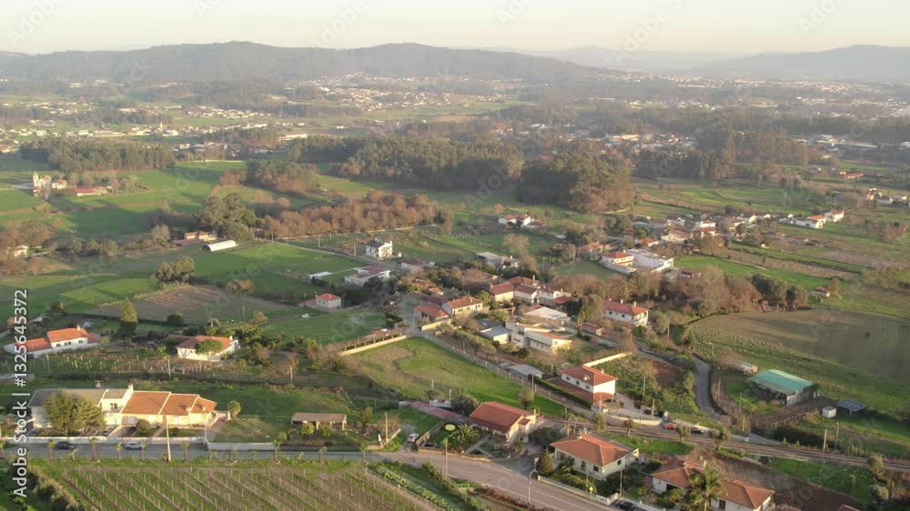 Aerial - rural landscape with vineyards, fields, and houses in Alto Minho, Portugal Aerial - rural landscape with vineyards, fields, and houses in Alto Minho, Portugal