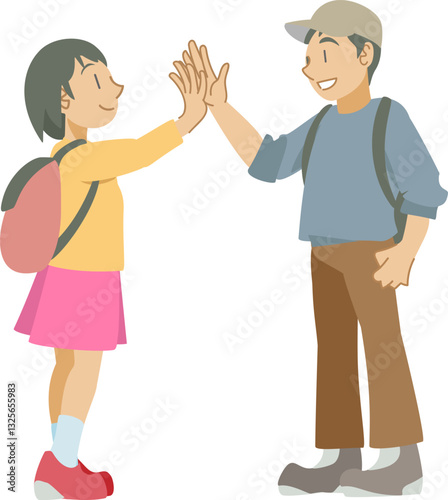 屋外でハイタッチする少年と少女