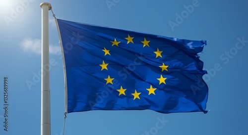 A blue flag with yellow stars blowing in the wind