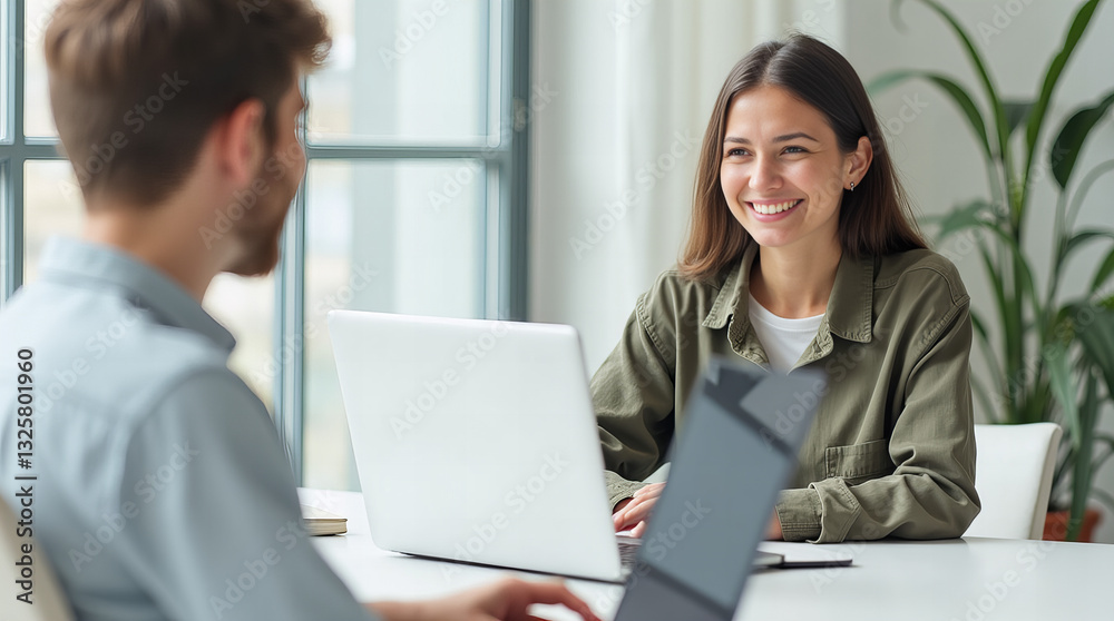 Collaborative teamwork in a modern office setting with smiling colleagues Collaborative teamwork in a modern office setting with smiling colleagues