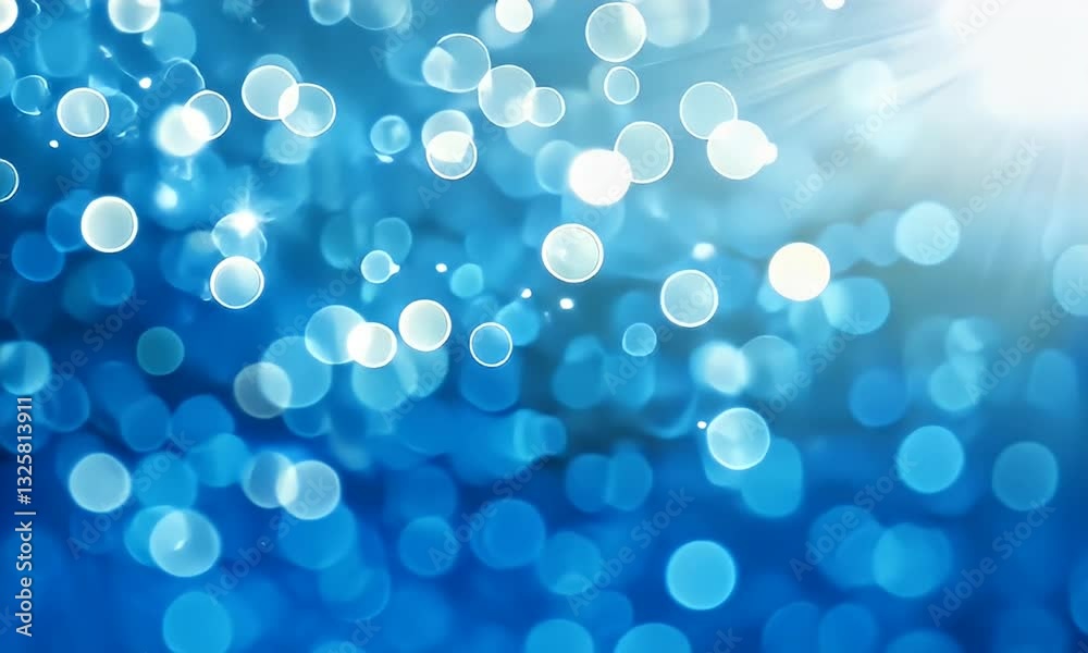 Sparkling light illuminates the blue background, creating an ethereal, dreamy, and magical effect Sparkling light illuminates the blue background, creating an ethereal, dreamy, and magical effect