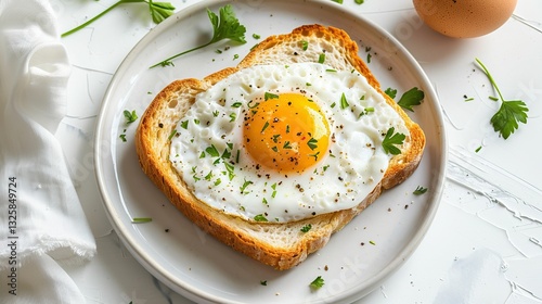 A delicious plate featuring a fried egg on toast, garnished with herbs, showcasing a simple yet appetizing breakfast scene.