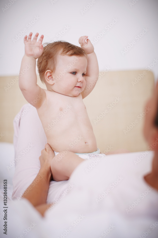 Baby, mother and playing with hands in home, love and learning motor skills in bedroom for growth. Development, infant daughter and security in relationship, together and support with new skill Baby, mother and playing with hands in home, love and learning motor skills in bedroom for growth. Development, infant daughter and security in relationship, together and support with new skill