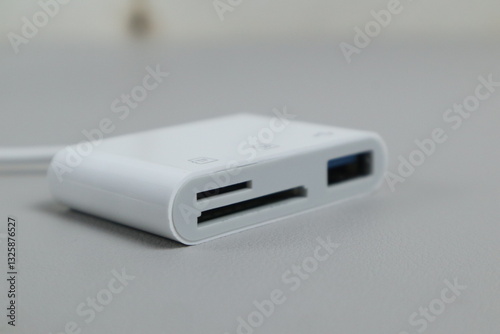 Kudus, 13 Maret 2025 - SD Card Camera Reader Adapter,Flashdisk to Apple iphone . isolated on white background.