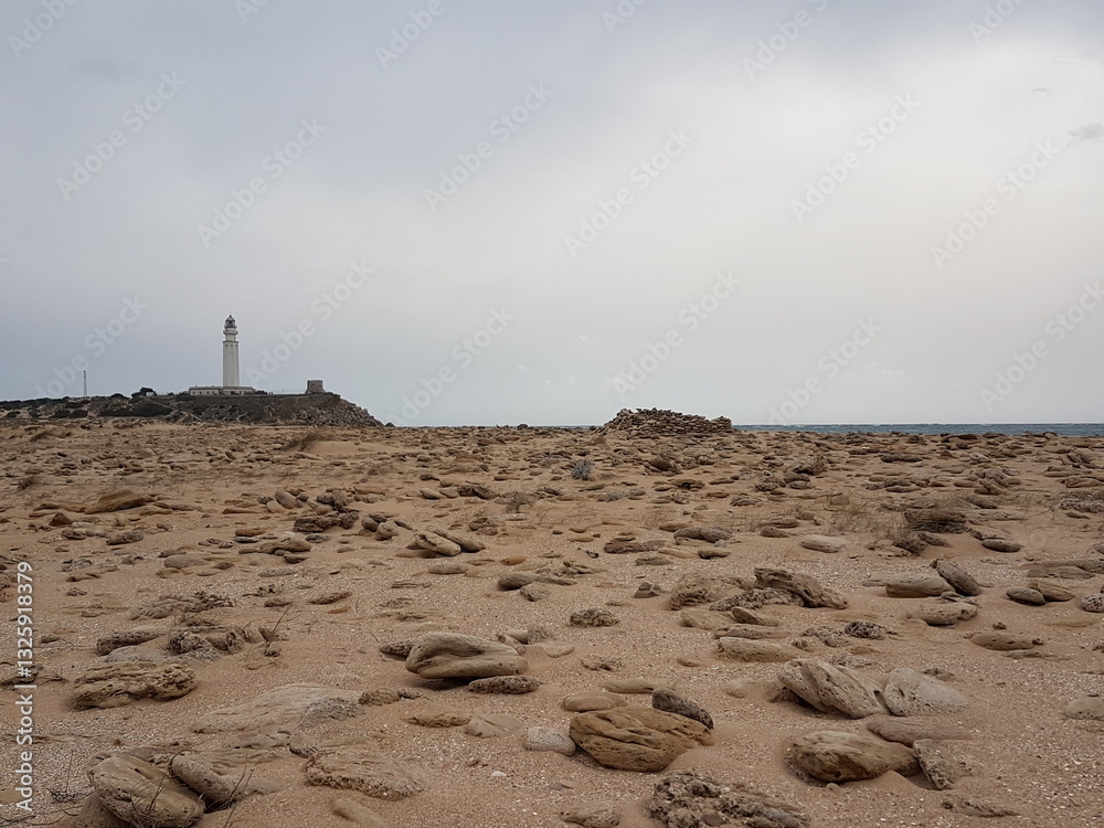 Lighthouse Trafalgar, Andalucia.
Loneliness at the beach of the cape of Trafalgar with a calm surrounding looking like a desert.