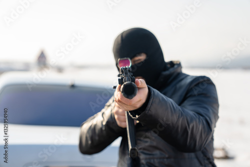 Criminal Using Weapon to Rob Civilians photo