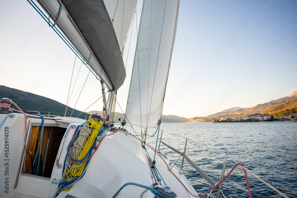 Obraz premium Yacht sailing in Adriatic sea. Close-up view of the deck, mast and sails. Yachting concept