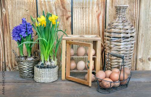 arrangement on wooden background of chicken eggs  in a decorative box  and  m...