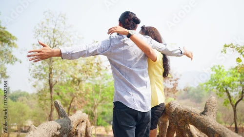 Bearded man lovingly opens his arms to embrace a girl