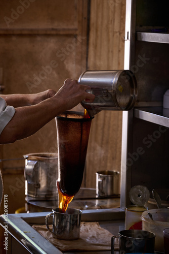 Pouring Hot Coffee Through a Cloth Filter – Classic Nanyang Brewing Method