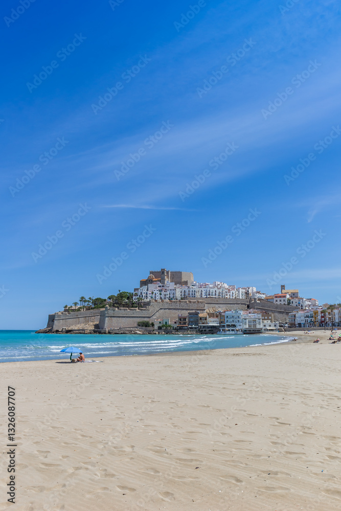 Beach in front of the historic town of Peniscola, Spain