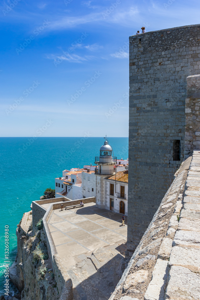 Castle wall and historic lighthouse in Peniscola, Spain
