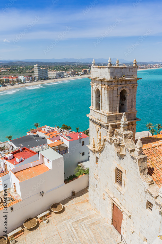 Historic church tower overlooking the mediterranean sea in Peniscola, Spain