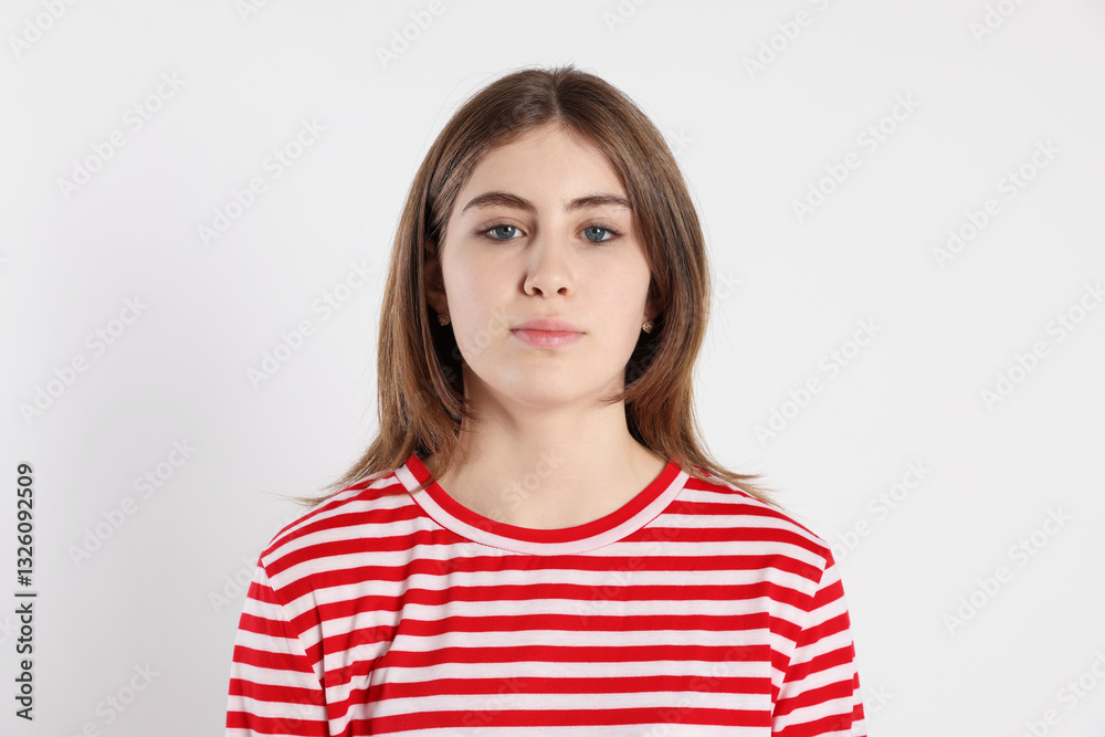 Portrait of beautiful teenage girl on light background Portrait of beautiful teenage girl on light background