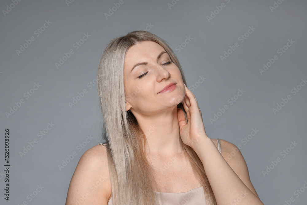 Portrait of beautiful woman on grey background Portrait of beautiful woman on grey background