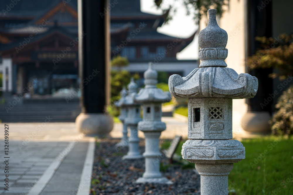 Obraz premium Traditional Stone Lanterns in Tranquil Zen Garden