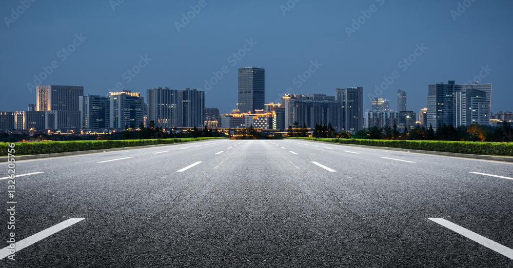 Obraz premium Expansive Urban Highway Leading to a Vibrant Skyline at Night