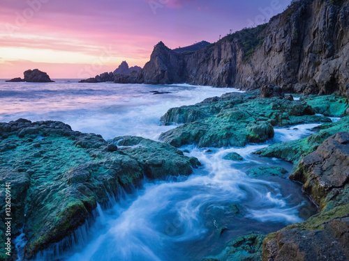 seascape at sunset with dramatic rock
