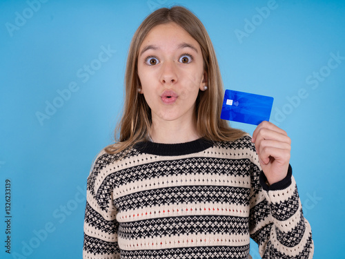 Photo of beautiful caucasian girl wearing striped sweater amazed shocked hold credit card payment