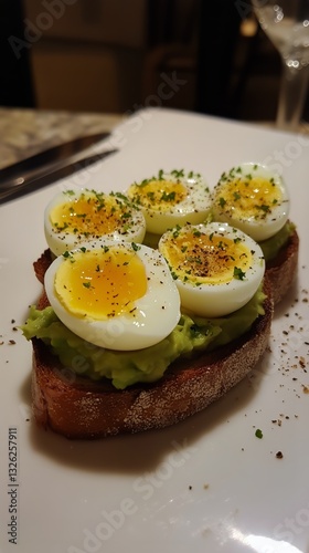 Delicious Avocado Toast Topped With Perfectly Cooked Eggs Served in a Cozy Re...