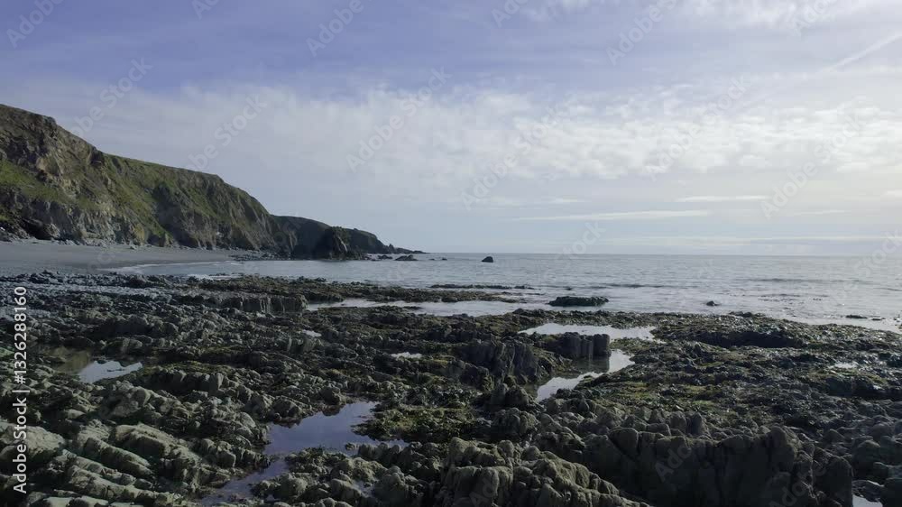 Ireland Coast drone flying along rocky coast at low tide Copper Coast Waterford Ireland Ireland Coast drone flying along rocky coast at low tide Copper Coast Waterford Ireland