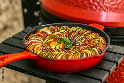 Wallpaper Mural Chef preparing traditional Provençal vegetable dish Ratatouille with stuffed rolled meat on the grill. French food. Healthy eating. Delicious vegetable Torontodigital.ca